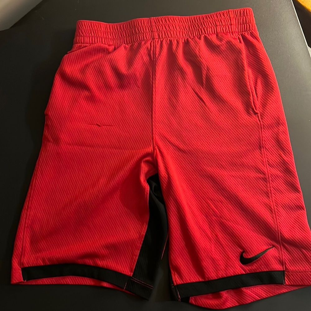 YXL Boys Nike dri fit shorts. Red with black trim
